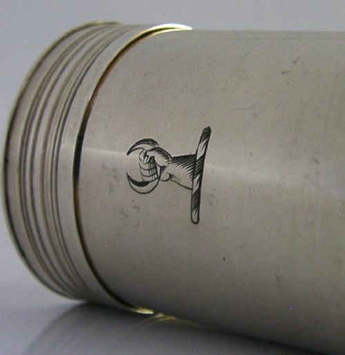 A Georgian sterling silver cylindrical caster top showing a hand-pierced dome with a gilded interior. View III