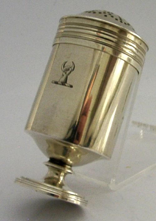 A Georgian sterling silver cylindrical caster top showing a hand-pierced dome with a gilded interior. View V