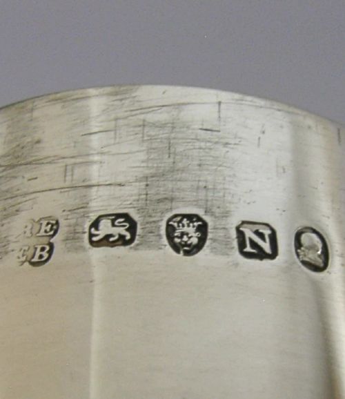 A Georgian sterling silver cylindrical caster top showing a hand-pierced dome with a gilded interior. View VIII