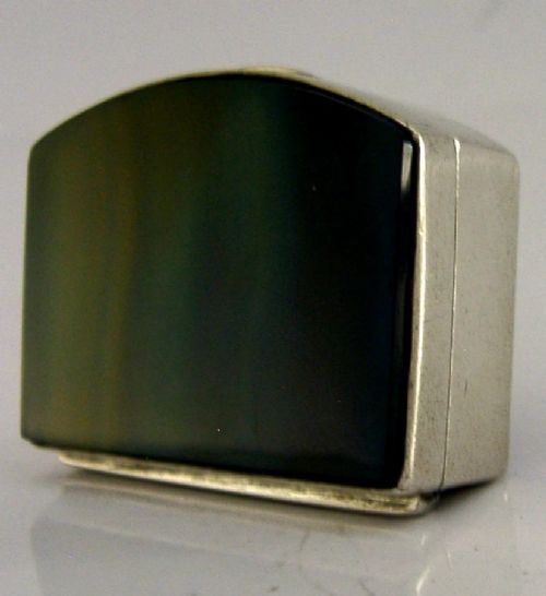 A small hinged sterling silver box featuring an arched lid mounted with a polished blue and yellow banded agate stone. View IV