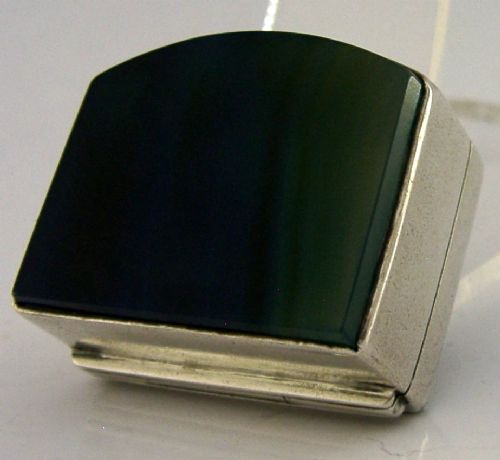 A small hinged sterling silver box featuring an arched lid mounted with a polished blue and yellow banded agate stone. View V