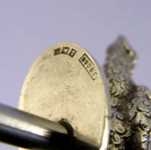 A sterling silver corkscrew featuring a sculpted handle in the shape of a pheasant in flight attached to a steel worm. View XII