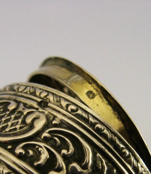 A circular French solid silver pill box with Rococo Revival lattice and floral scroll embossing. View VIII