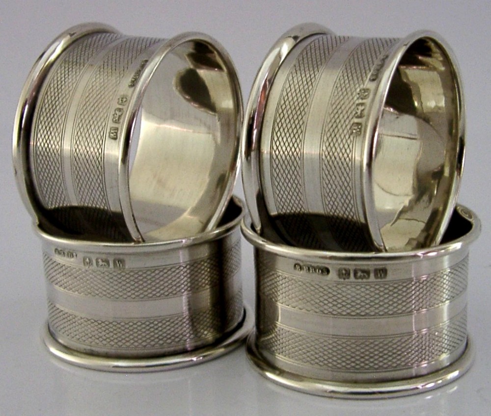 FOUR ENGLISH SOLID STERLING SILVER ENGINE TURNED NAPKIN RINGS 1921 ART DECO View II