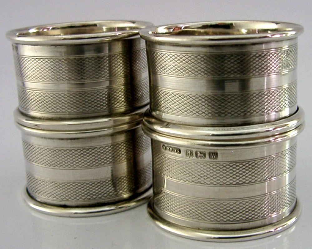 FOUR ENGLISH SOLID STERLING SILVER ENGINE TURNED NAPKIN RINGS 1921 ART DECO View III