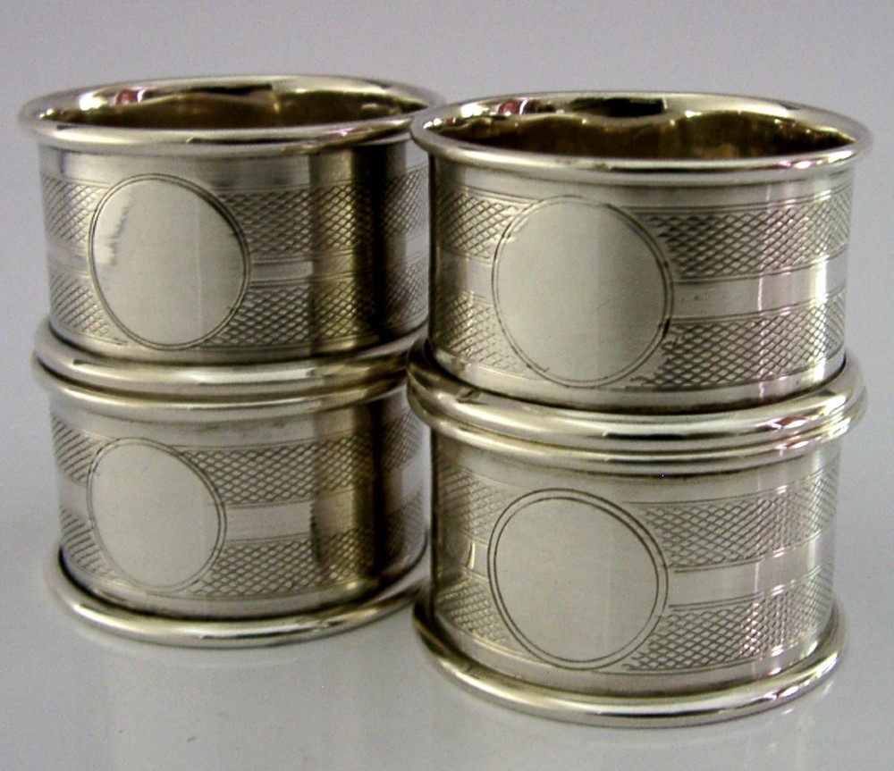 FOUR ENGLISH SOLID STERLING SILVER ENGINE TURNED NAPKIN RINGS 1921 ART DECO View V