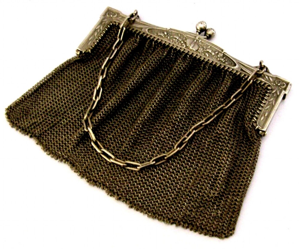 An antique French solid silver chain link mesh purse featuring an ornate Art Nouveau carved frame with a pinecone clasp. View IV