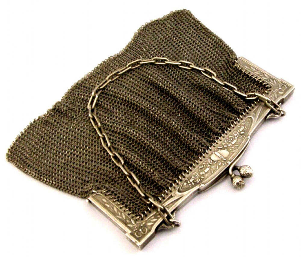 An antique French solid silver chain link mesh purse featuring an ornate Art Nouveau carved frame with a pinecone clasp. View V