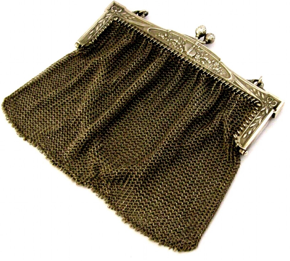An antique French solid silver chain link mesh purse featuring an ornate Art Nouveau carved frame with a pinecone clasp. View VI