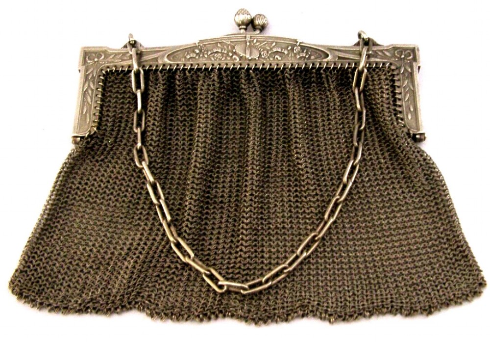 An antique French solid silver chain link mesh purse featuring an ornate Art Nouveau carved frame with a pinecone clasp. View VII