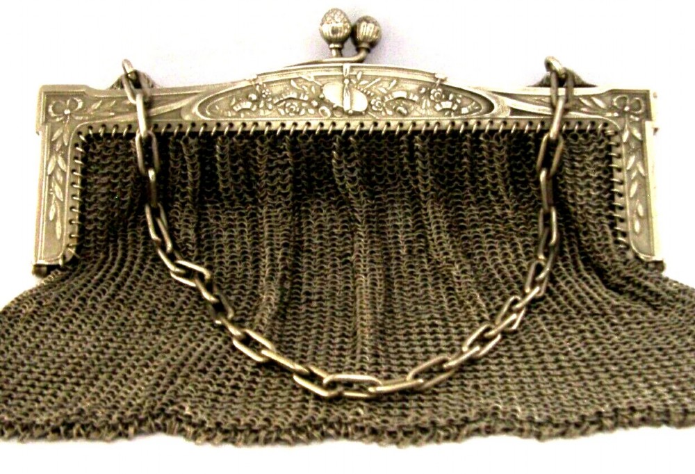 An antique French solid silver chain link mesh purse featuring an ornate Art Nouveau carved frame with a pinecone clasp. View VIII