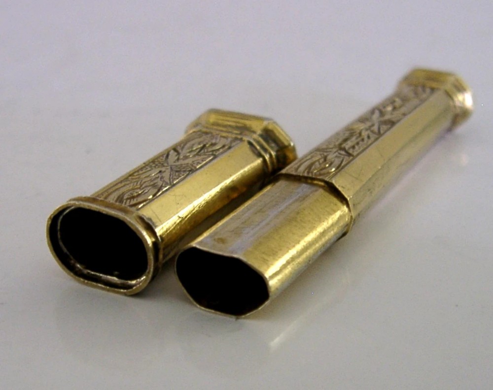 An antique French silver gilt needle case featuring engraved foliage and moulded finials. View IV