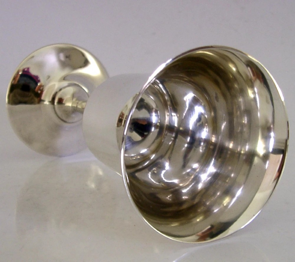 A polished sterling silver goblet featuring a flared bowl, slender stem, and circular stepped base. View II