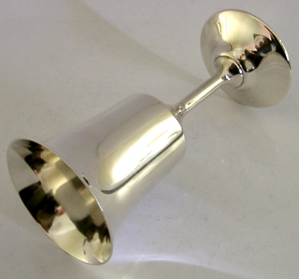 A polished sterling silver goblet featuring a flared bowl, slender stem, and circular stepped base. View III