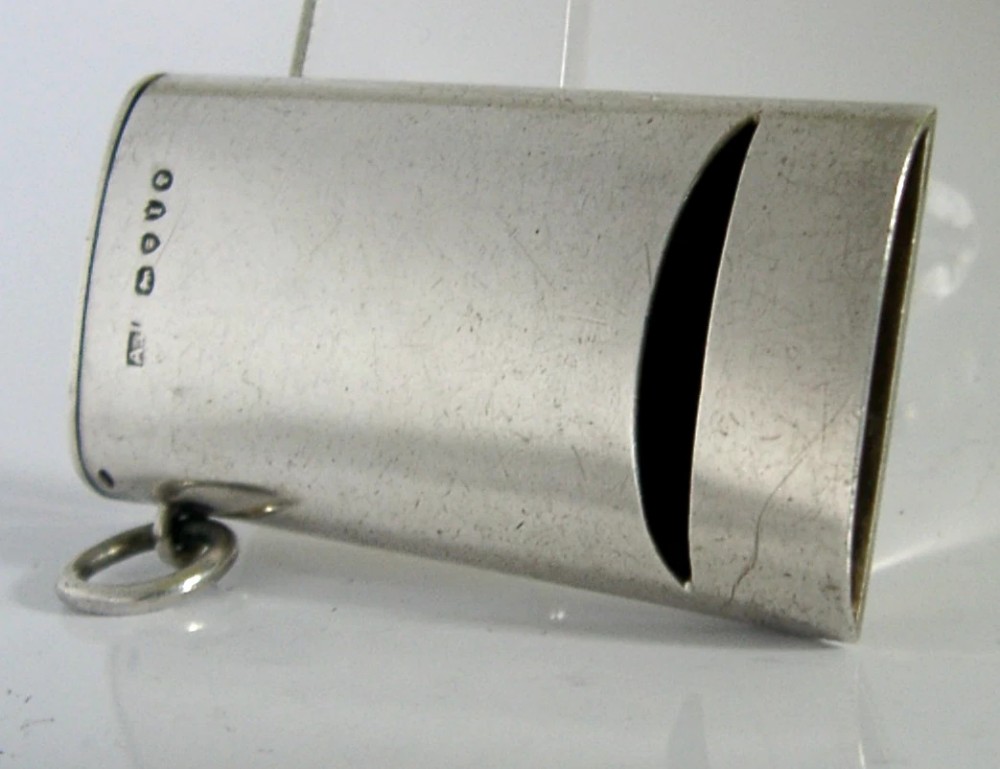 A rectangular Victorian sterling silver combined vesta case and whistle featuring hallmarked silver casing and an attached suspension ring. View III
