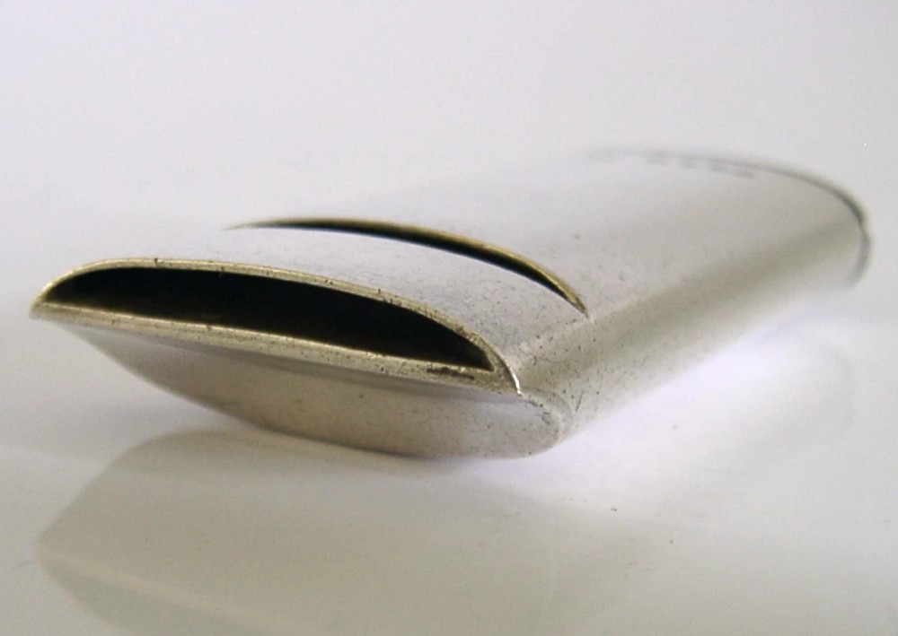A rectangular Victorian sterling silver combined vesta case and whistle featuring hallmarked silver casing and an attached suspension ring. View VI
