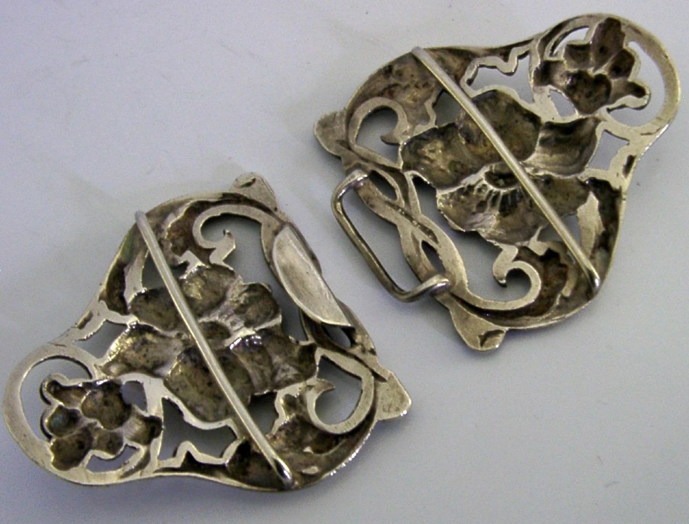 A two-piece cast sterling silver Art Nouveau belt buckle featuring relief floral and foliage motifs. View VIII