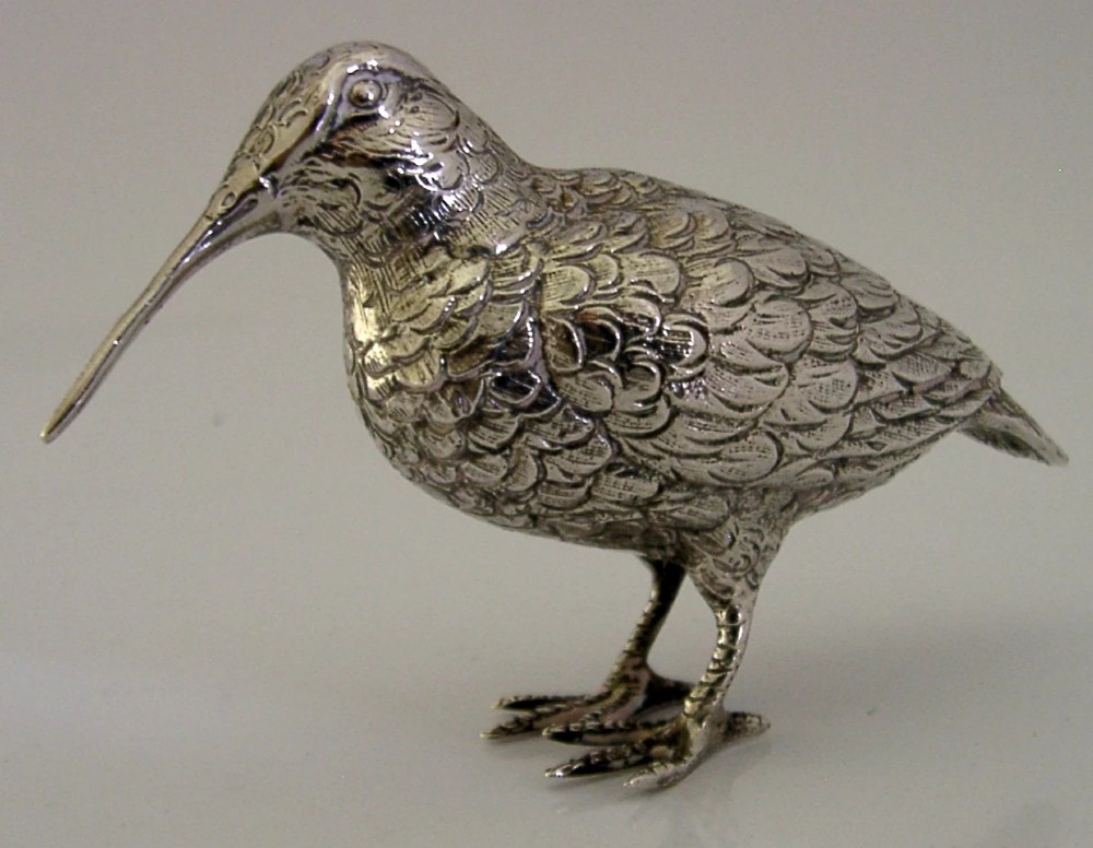 An 830 silver figurine of a woodcock featuring detailed feather chasing and a long slender beak.