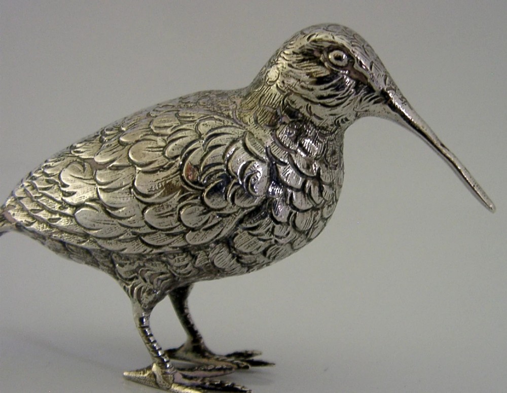 An 830 silver figurine of a woodcock featuring detailed feather chasing and a long slender beak. View V