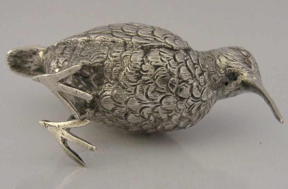 An 830 silver figurine of a woodcock featuring detailed feather chasing and a long slender beak. View IX