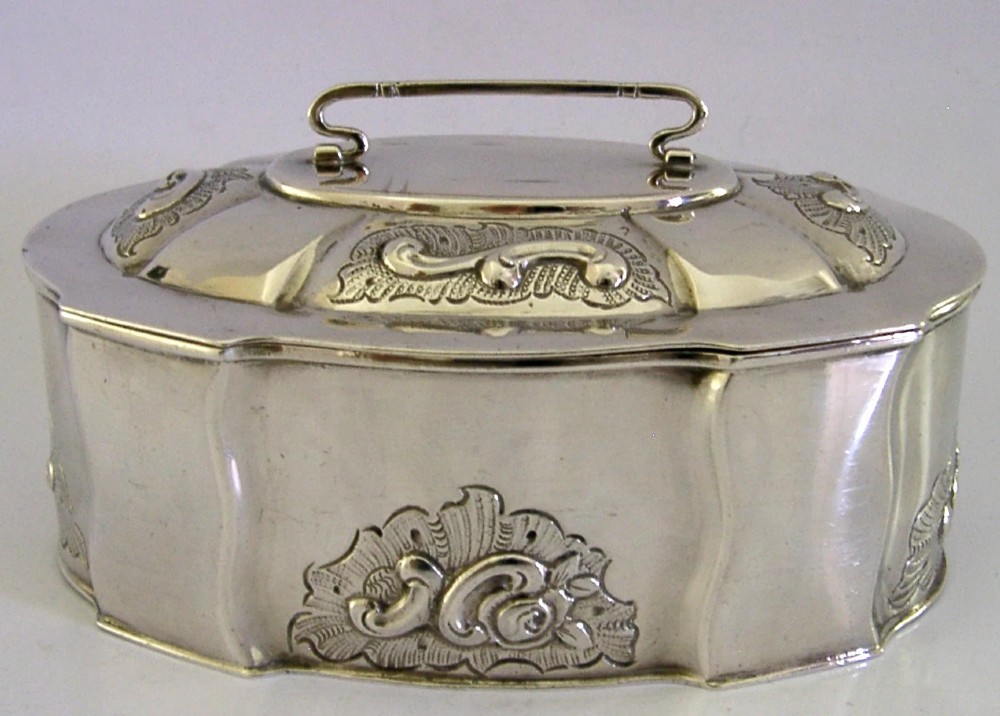 An oval Danish sterling silver jewellery box with an open hinged lid, featuring lobed sides and embossed scroll motifs. View II