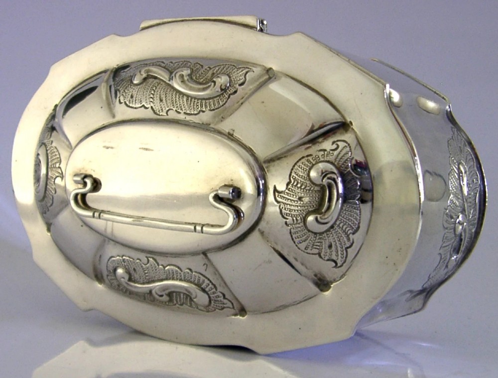 An oval Danish sterling silver jewellery box with an open hinged lid, featuring lobed sides and embossed scroll motifs. View IV