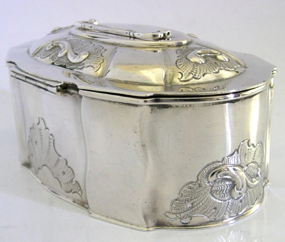 An oval Danish sterling silver jewellery box with an open hinged lid, featuring lobed sides and embossed scroll motifs. View VII