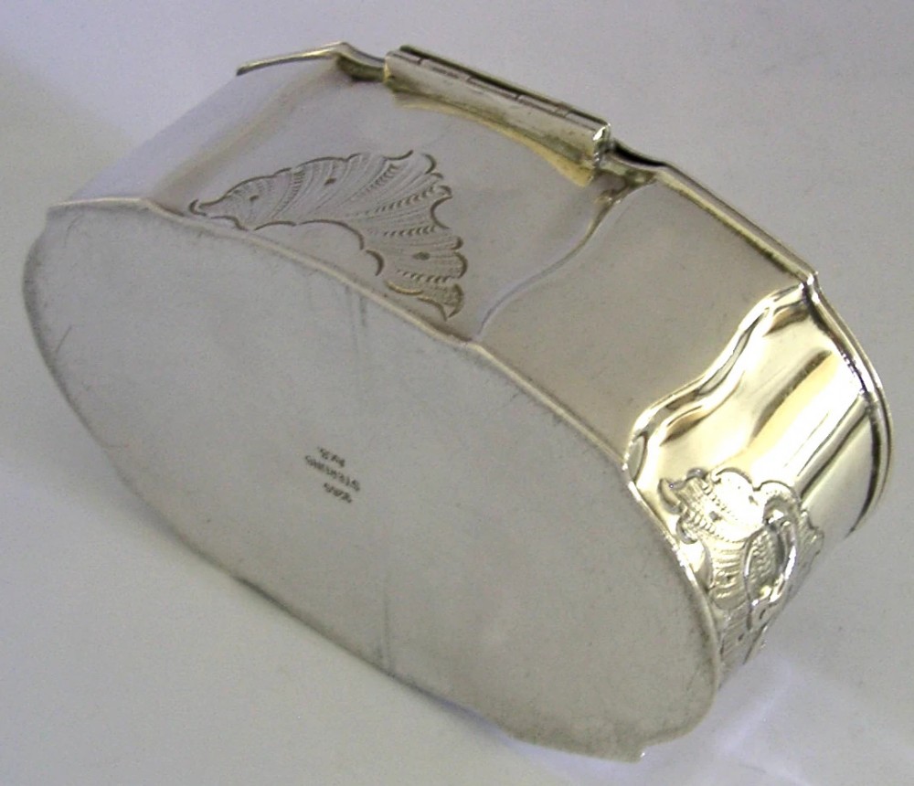 An oval Danish sterling silver jewellery box with an open hinged lid, featuring lobed sides and embossed scroll motifs. View VIII