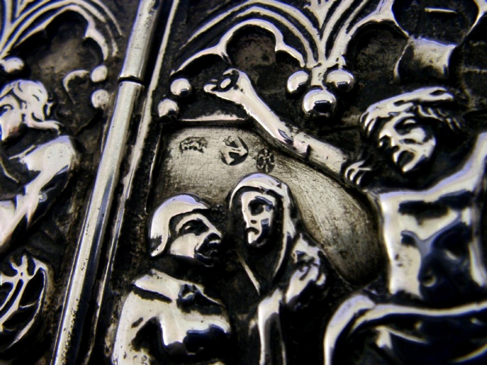 A late nineteenth-century German Hanau silver folding travel triptych featuring a central relief depiction of the Crucifixion flanked by hinged side panels within Gothic arches. View VIII