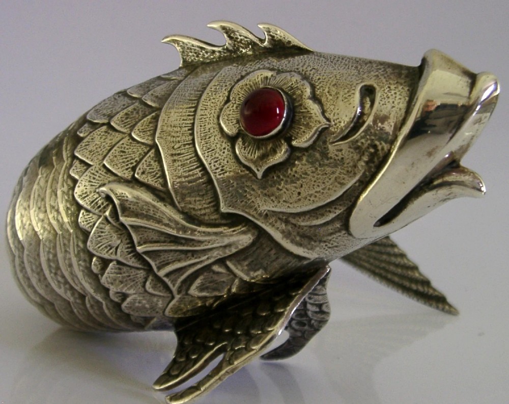 A mid-twentieth-century Spanish 915 silver articulated fish figure with engraved scales, structured fins, and a red cabochon eye. View IV