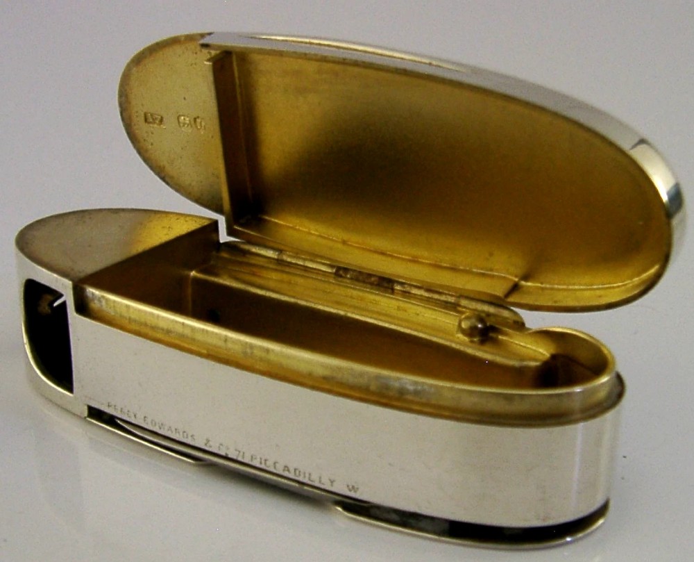 A Victorian sterling silver cigar cutter multi-tool with hallmarked silver casing and open fold-out steel implement. View II