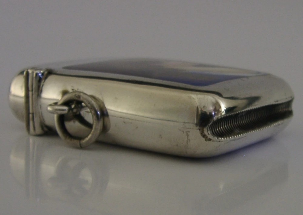An Edwardian sterling silver vesta case featuring a central hand-painted enamel portrait panel of a female figure in profile against a dark background. View VI
