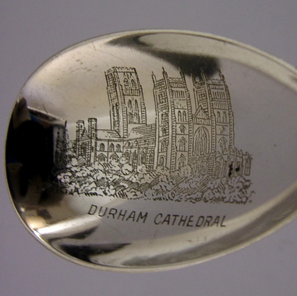 An Edwardian sterling silver tea caddy spoon featuring an engraved illustration of Durham Cathedral in the bowl and the Sanctuary Knocker on the handle. View III