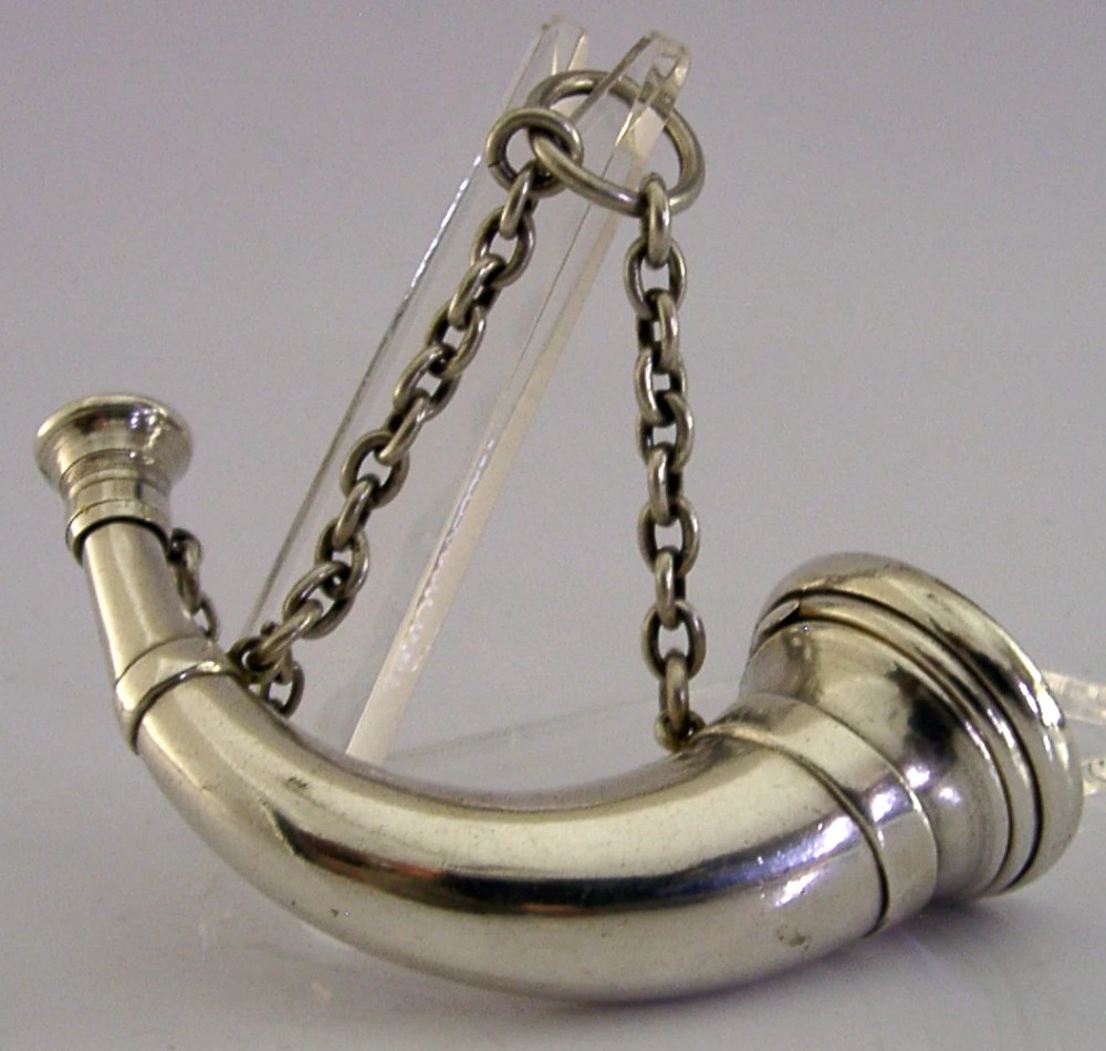 Victorian sterling silver vinaigrette shaped as a curved hunting horn with attached suspension chain.