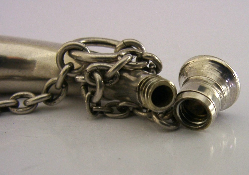 Victorian sterling silver vinaigrette shaped as a curved hunting horn with attached suspension chain. View V