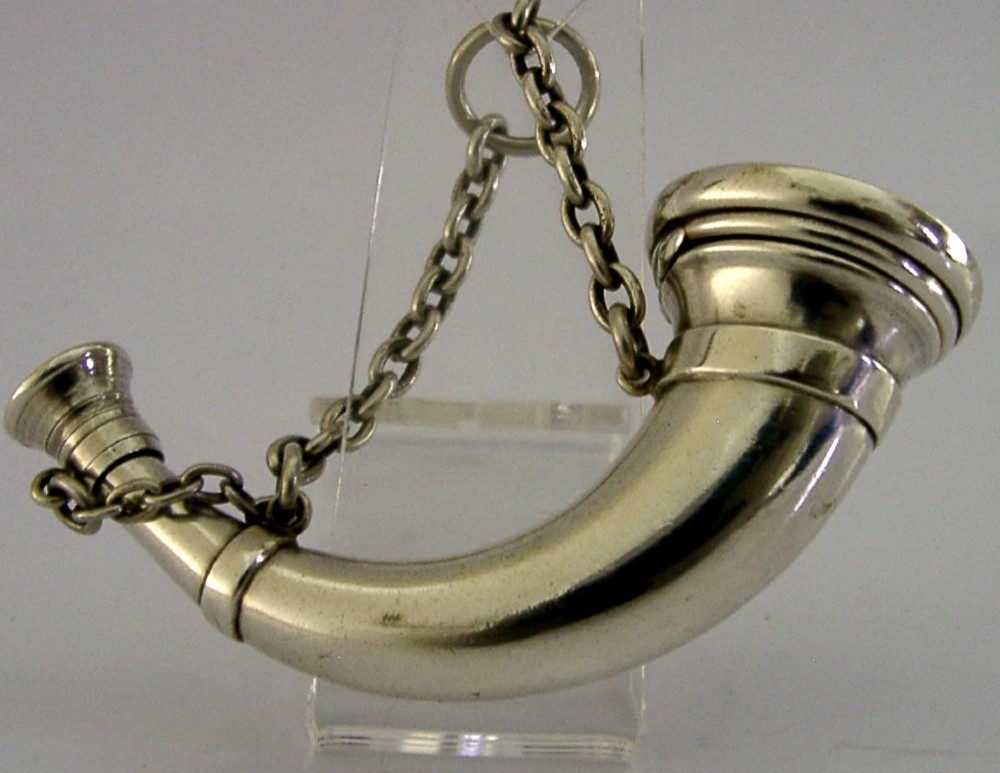 Victorian sterling silver vinaigrette shaped as a curved hunting horn with attached suspension chain. View VI