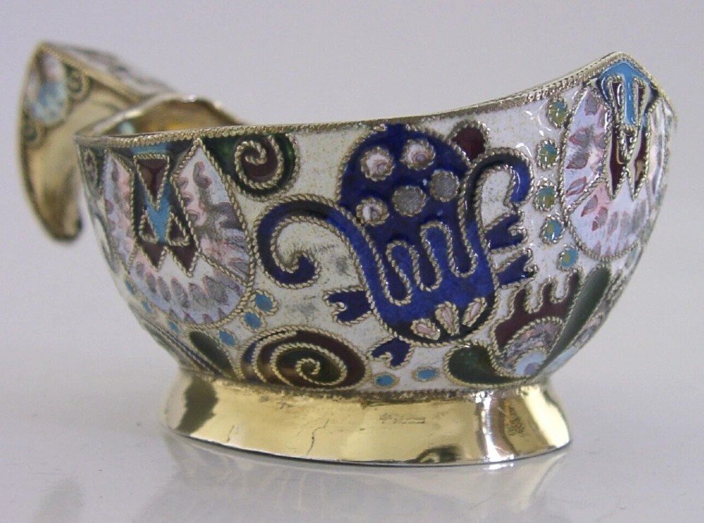 An antique boat-shaped Russian silver-gilt kovsh decorated with polychrome cloisonne enamel floral scrollwork and a gold-plated interior. View III