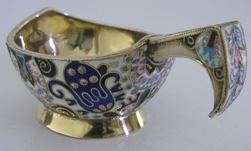 An antique boat-shaped Russian silver-gilt kovsh decorated with polychrome cloisonne enamel floral scrollwork and a gold-plated interior. View IV