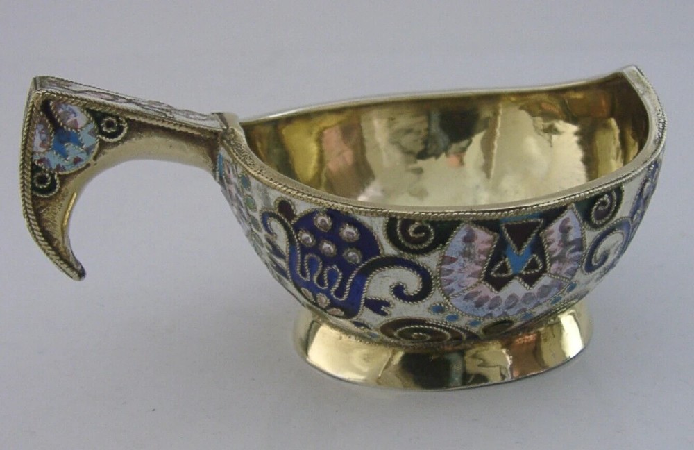 An antique boat-shaped Russian silver-gilt kovsh decorated with polychrome cloisonne enamel floral scrollwork and a gold-plated interior. View V