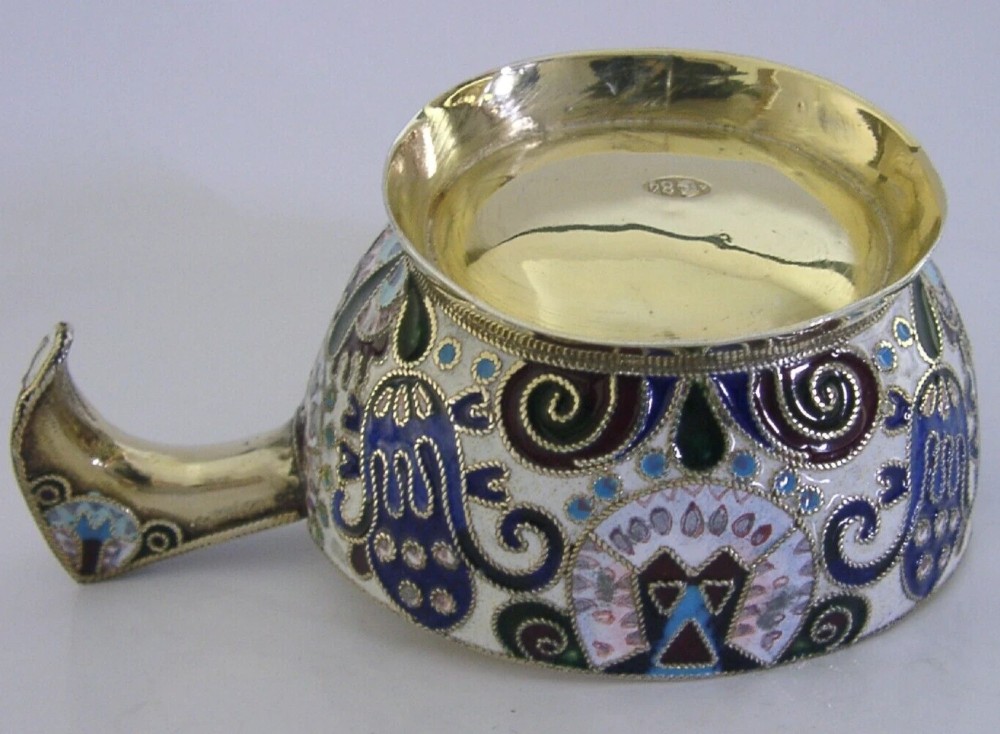 An antique boat-shaped Russian silver-gilt kovsh decorated with polychrome cloisonne enamel floral scrollwork and a gold-plated interior. View VI