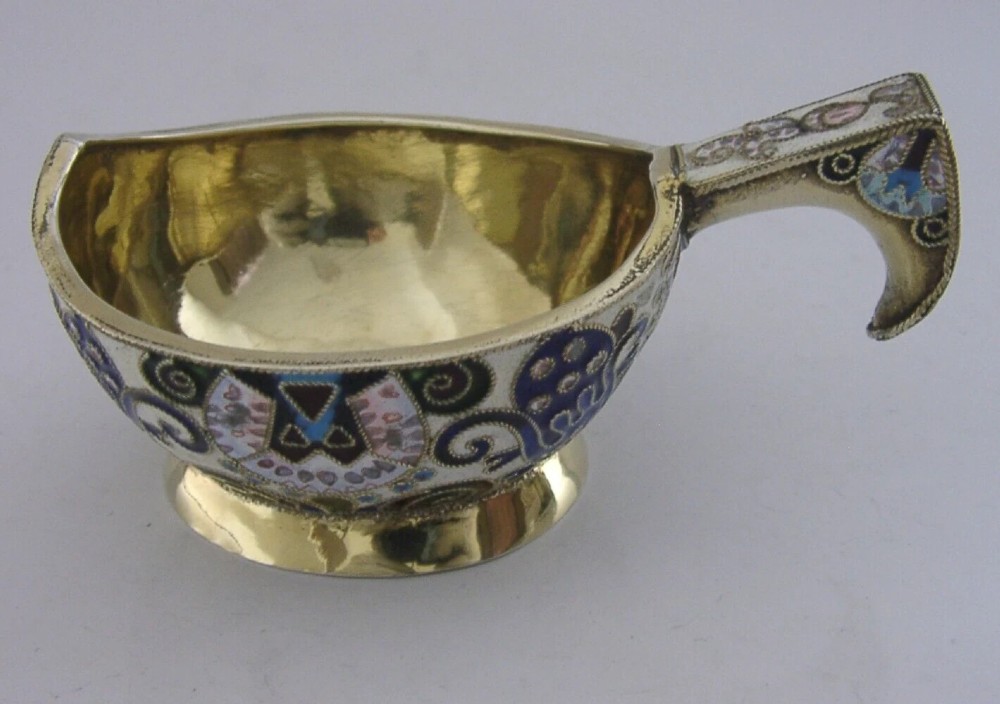 An antique boat-shaped Russian silver-gilt kovsh decorated with polychrome cloisonne enamel floral scrollwork and a gold-plated interior. View VII
