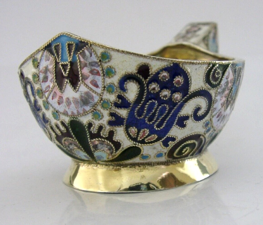 An antique boat-shaped Russian silver-gilt kovsh decorated with polychrome cloisonne enamel floral scrollwork and a gold-plated interior. View VIII