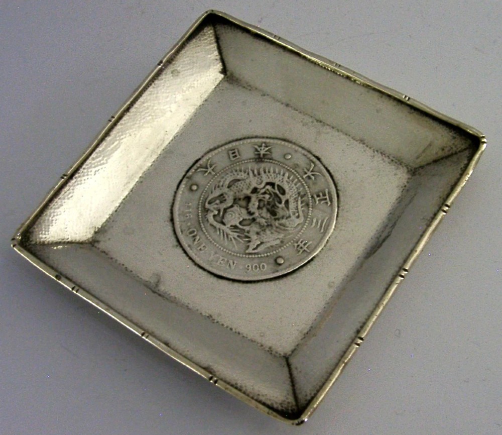 A square sterling silver coin dish featuring a central Japanese One Yen silver coin, hand-hammered interior border, and bamboo-style rim. View II