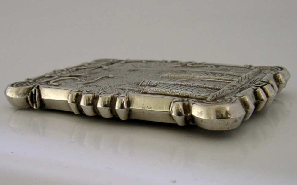 A mid-19th-century sterling silver card case featuring an embossed architectural depiction of Trinity Church surrounded by foliate scrollwork. View VIII