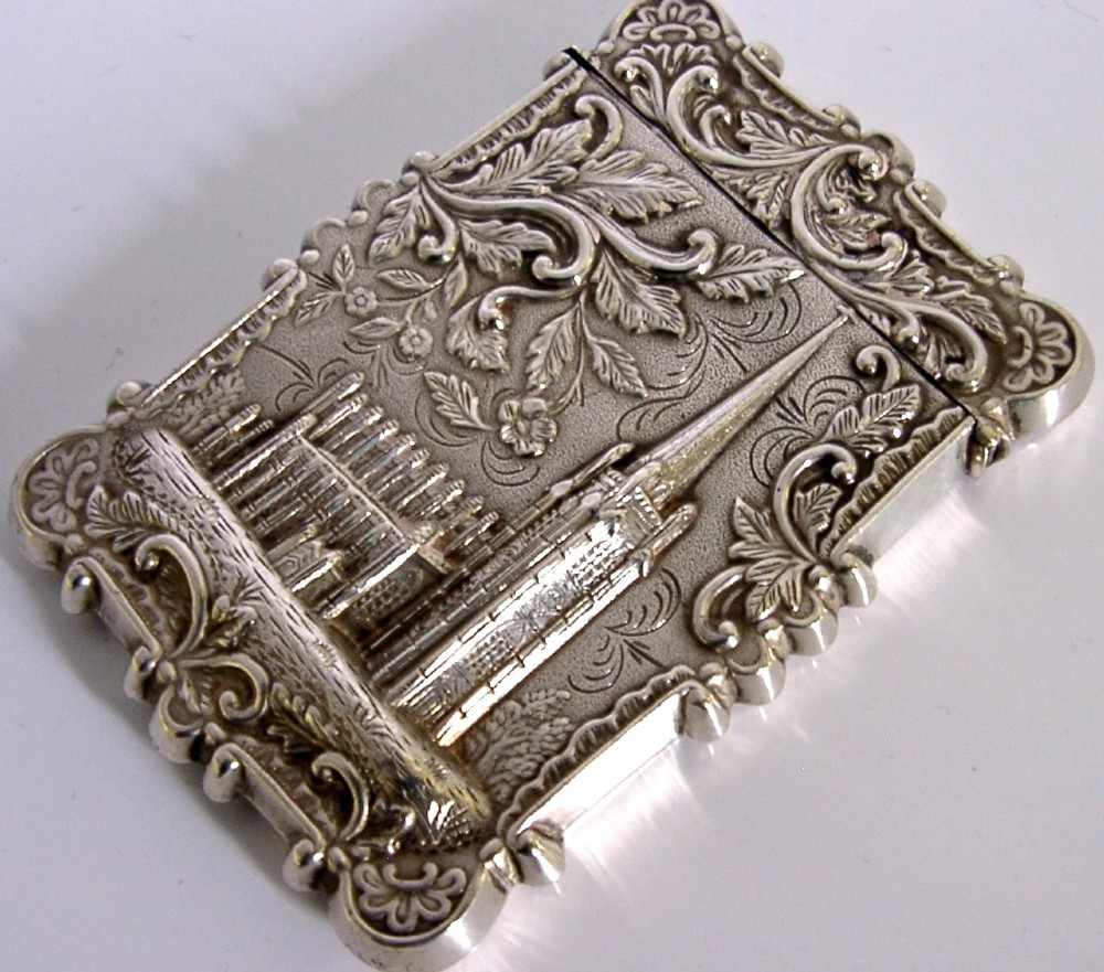 A mid-19th-century sterling silver card case featuring an embossed architectural depiction of Trinity Church surrounded by foliate scrollwork. View IX
