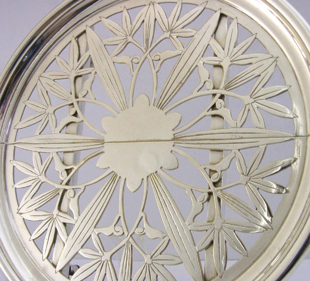A circular French Art Deco silver plated extending dish stand featuring pierced botanical foliage motifs. View III