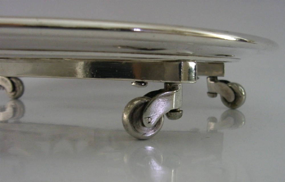 A circular French Art Deco silver plated extending dish stand featuring pierced botanical foliage motifs. View IV
