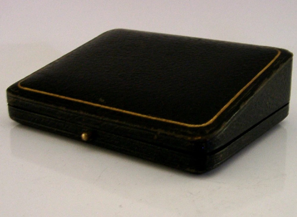 A sterling silver thumb magnifier glass with an adjustable arm clip rested inside a black velvet and silk lined presentation box. View VIII