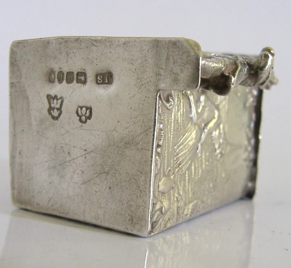 An antique Hanau silver miniature sentry post featuring a uniformed soldier guard standing beside an arched entryway with chased decorative detailing. View VII