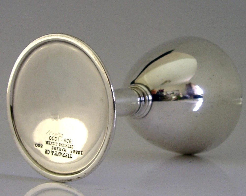 An Art Deco sterling silver cocktail goblet featuring a polished surface, a conical bowl, a turned stem, and a flat circular base. View VII